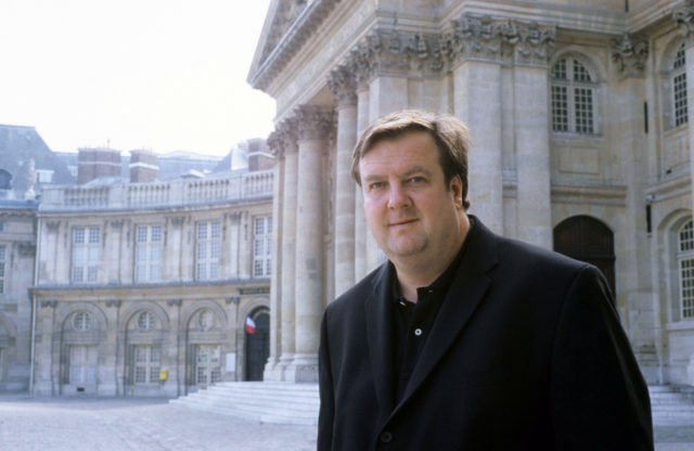 IMAGE: Picture showing Andrew Hussey OBE outside historic building